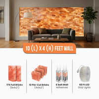 A wall-mounted salt brick accent wall shown installed above a sofa in a living room, with text indicating a 10 x 4 feet wall made of 174 full and 12 pre-cut salt bricks, plus six salt wall adhesives and 60 ft LED strip lights.