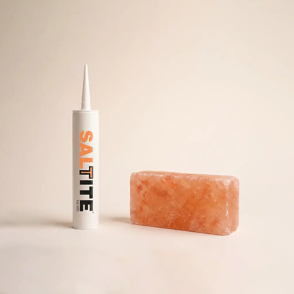 Saltite adhesive tube beside a Himalayan salt brick